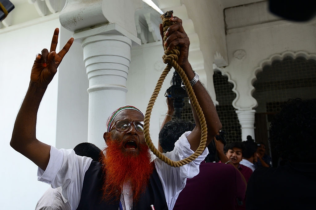 Bangladeshi activists celebrate the hanging of war criminals of the 1971 war. (STR/AFP/Getty Images)